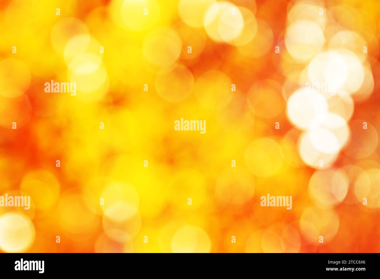 Abstact vibrante golden, giallo cerchio arancione bokeh texture di sfondo Foto Stock