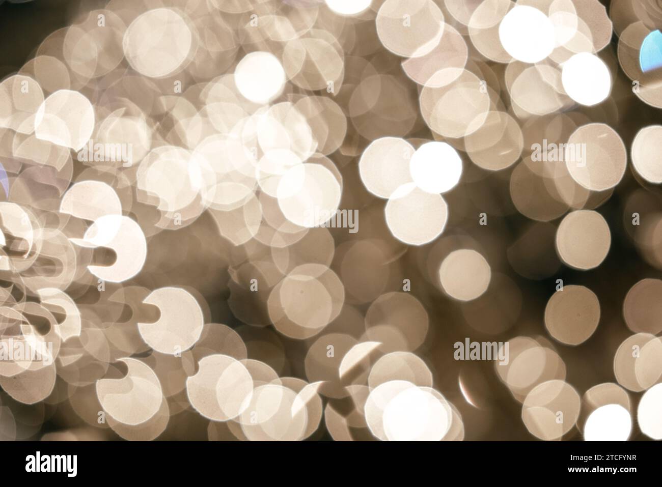Bokeh dorato come sfondo. Foto Stock
