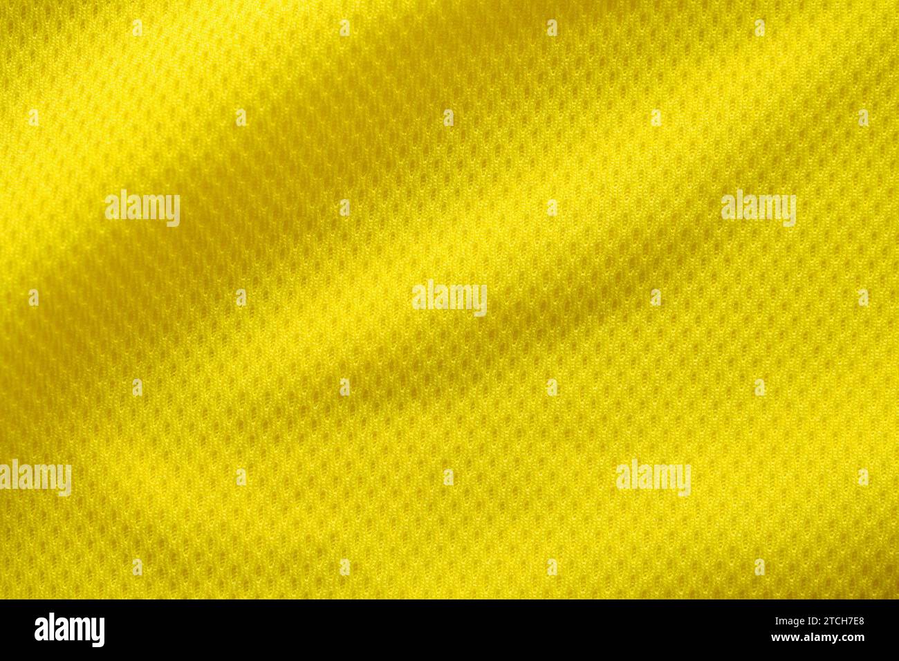 Maglia da calcio di colore giallo tessuto tessuto abbigliamento sportivo sfondo, primo piano Foto Stock