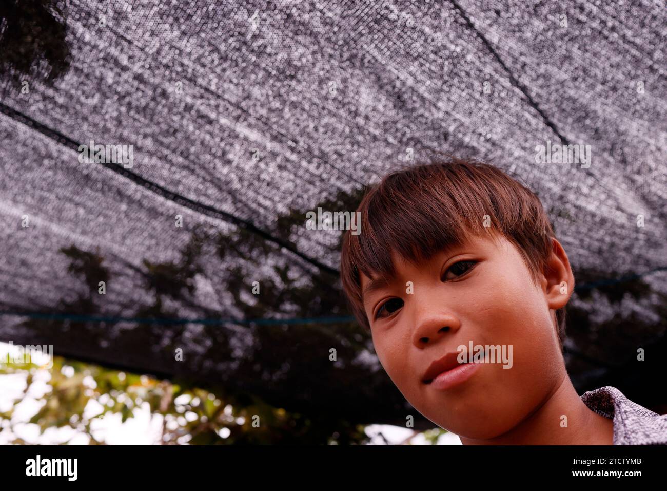 Ritratto di un giovane ragazzo asiatico. Foto Stock