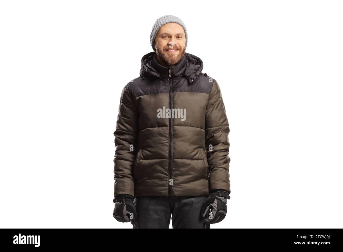 Uomo con giacca invernale e pantaloni isolati su sfondo bianco Foto Stock