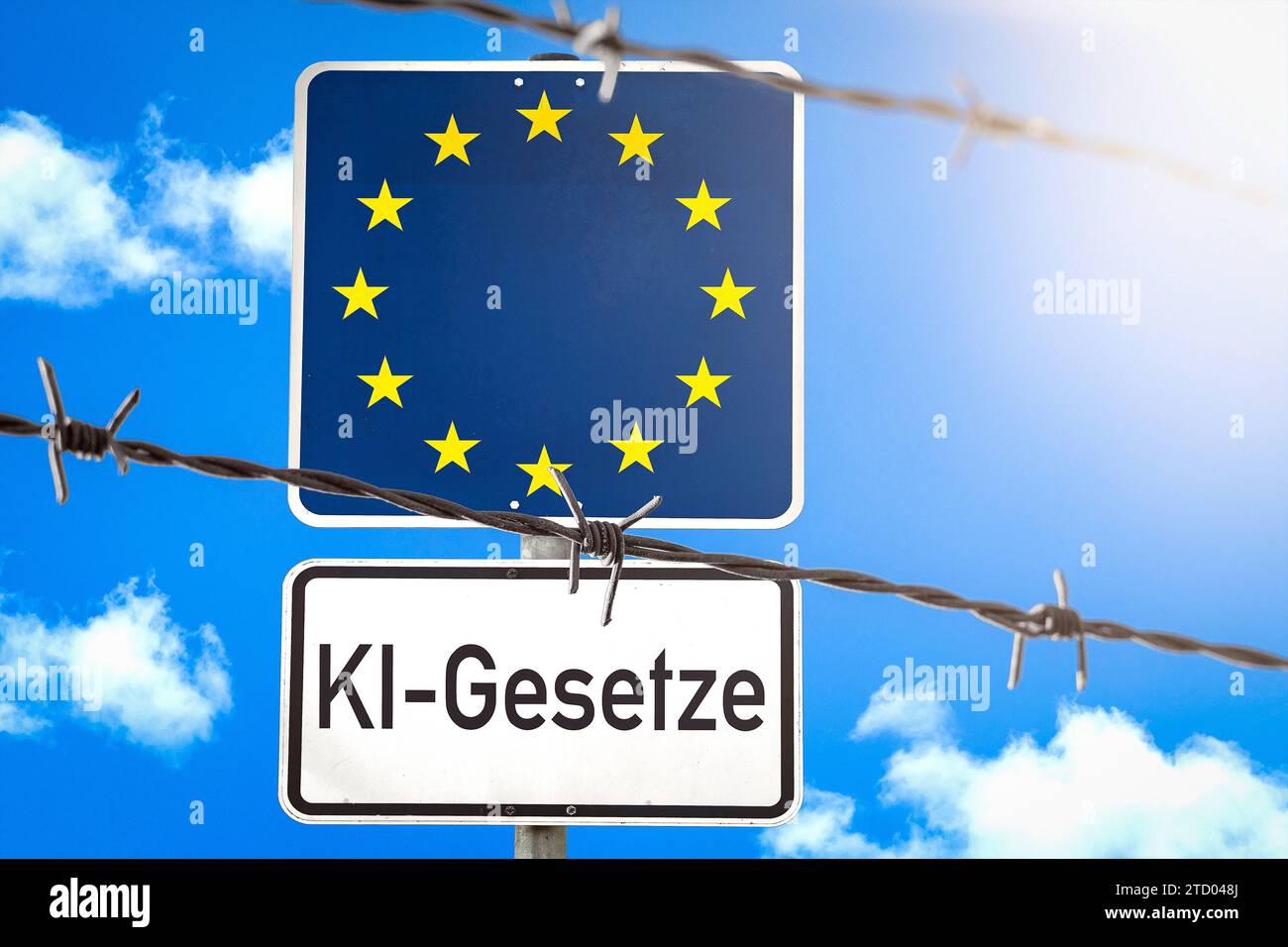15 dicembre 2023: Firma con bandiera UE dietro una recinzione di filo spinato con l'iscrizione ai laws PHOTOMONTAGE *** Schild mit EU-Flagge hinter einem Stacheldrahtzahn mit der Aufschrift KI-Gesetze FOTOMONTAGE Foto Stock