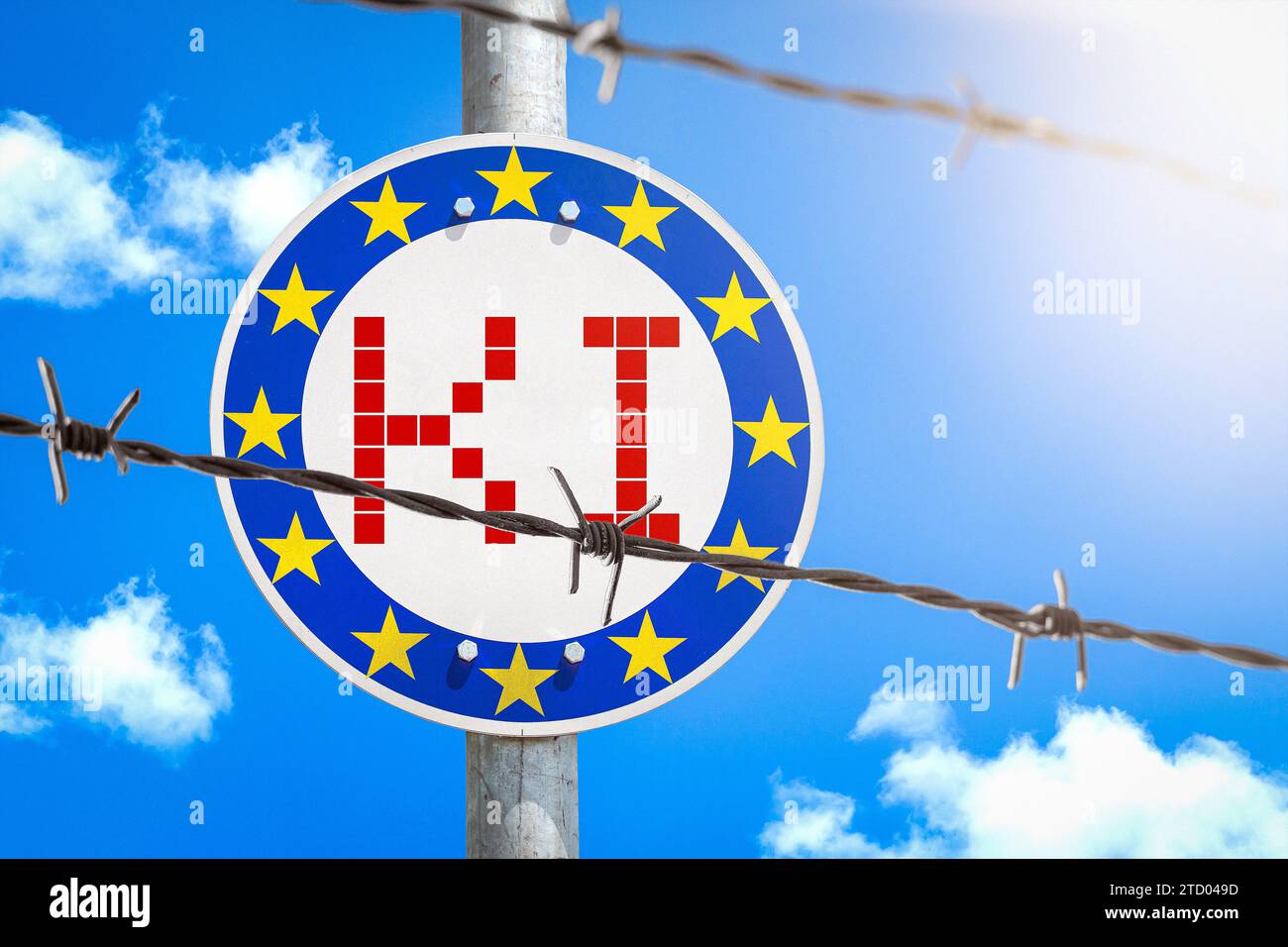 15 dicembre 2023: Firma con bandiera UE dietro una recinzione di filo spinato con l'iscrizione ai Artificial Intelligence PHOTOMONTAGE *** Schild mit EU-Flagge hinter einem Stacheldrahtzahn mit der Aufschrift KI Künstliche Intelligenz FOTOMONTAGE Foto Stock