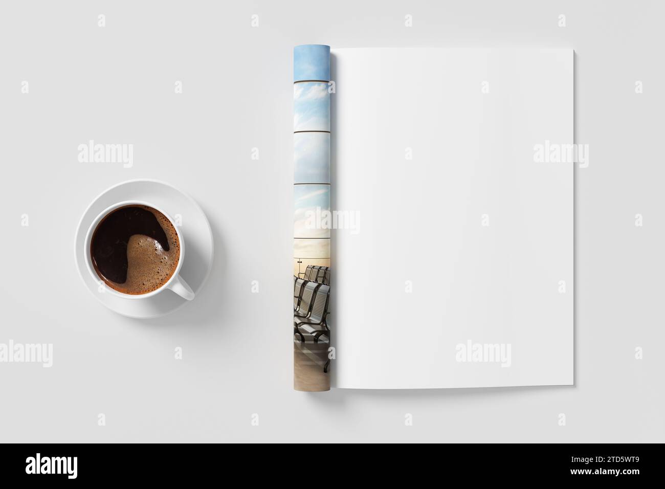 Un modello di rivista sulla pagina destra e una tazza di caffè su una scrivania bianca. illustrazione 3d. Foto Stock