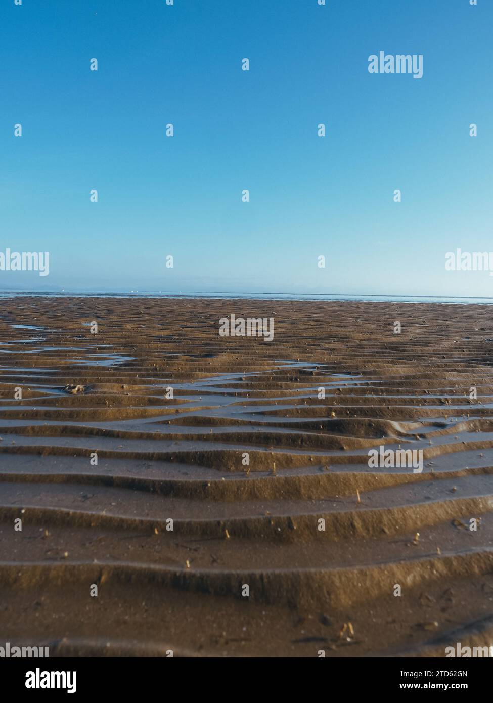 Increspature su una spiaggia sabbiosa, Galles Foto Stock