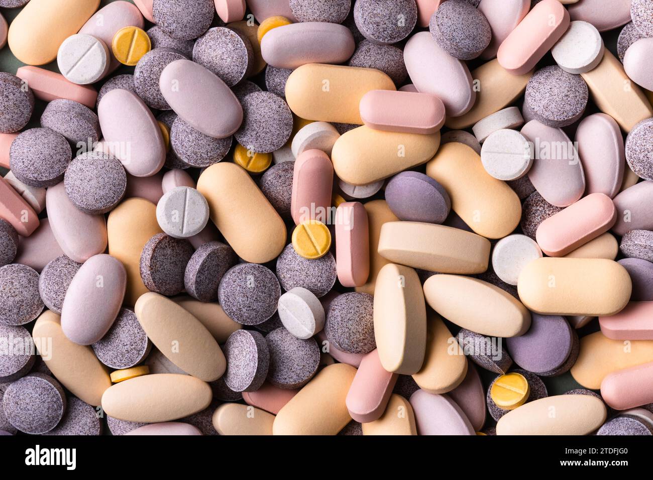 Pillole colorate pastello e tavolette di sfondo Foto Stock