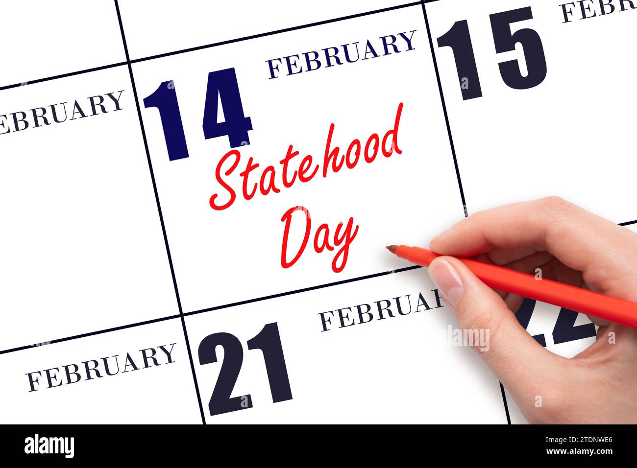 14 febbraio. Scrivere a mano il testo dello stato giorno della data del calendario. Segnatevi la data. Vacanze. Concetto di giorno dell'anno. Foto Stock