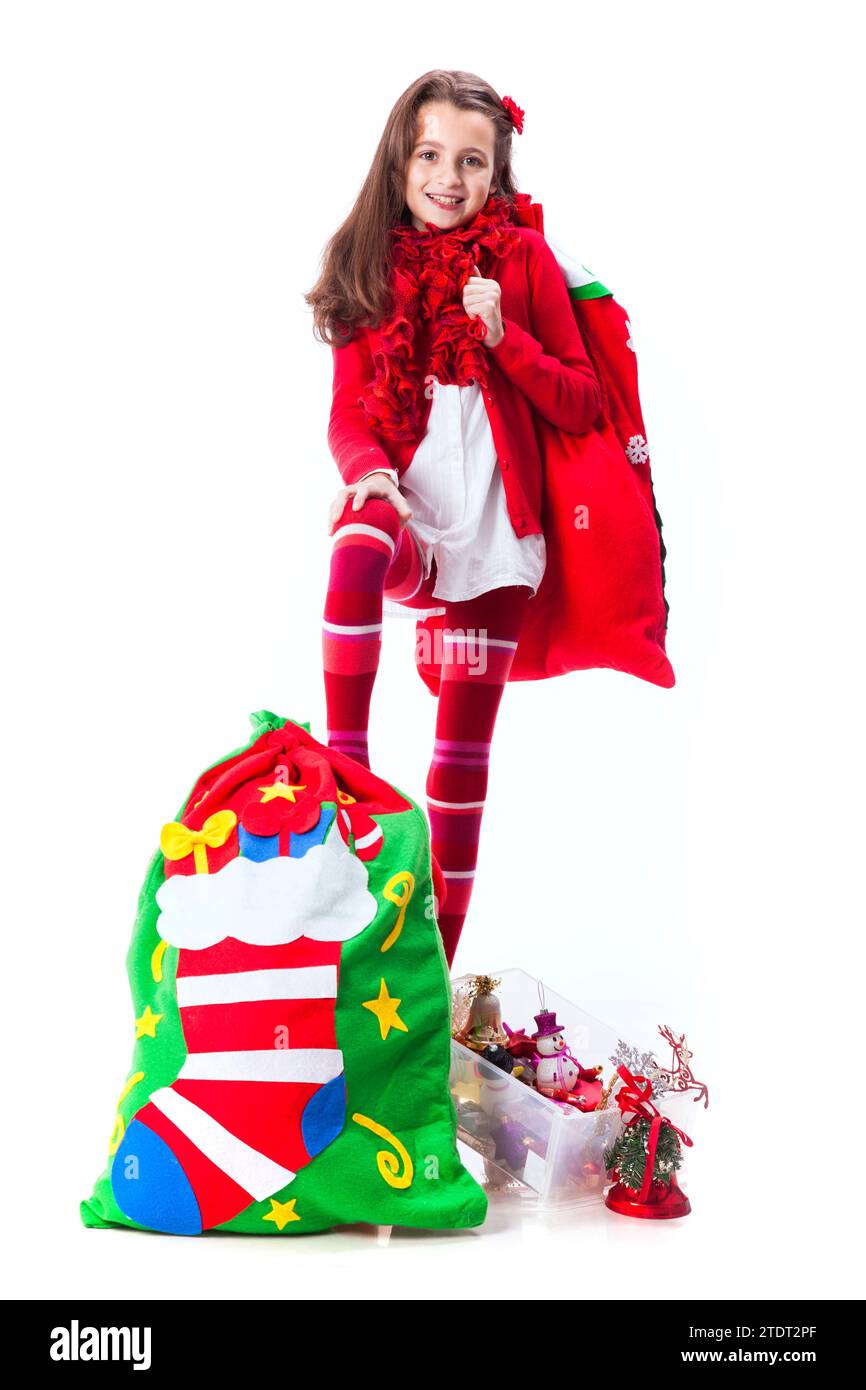 Bambina che tiene la borsa di babbo natale Foto Stock