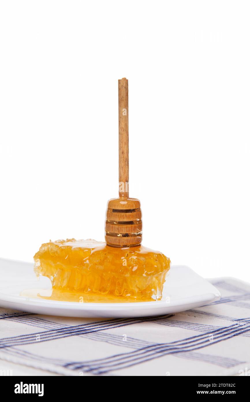 Piatto a tavola con nido d'ape Foto Stock