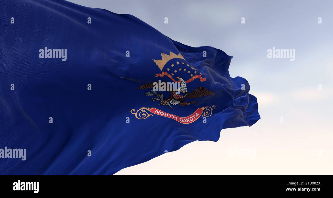 Primo piano della bandiera dello stato del North Dakota. Blu con stemma. "Eagle sopra il rotolo "North Dakota"." rendering dell'illustrazione 3d. Messa a fuoco selettiva. Flutte Foto Stock