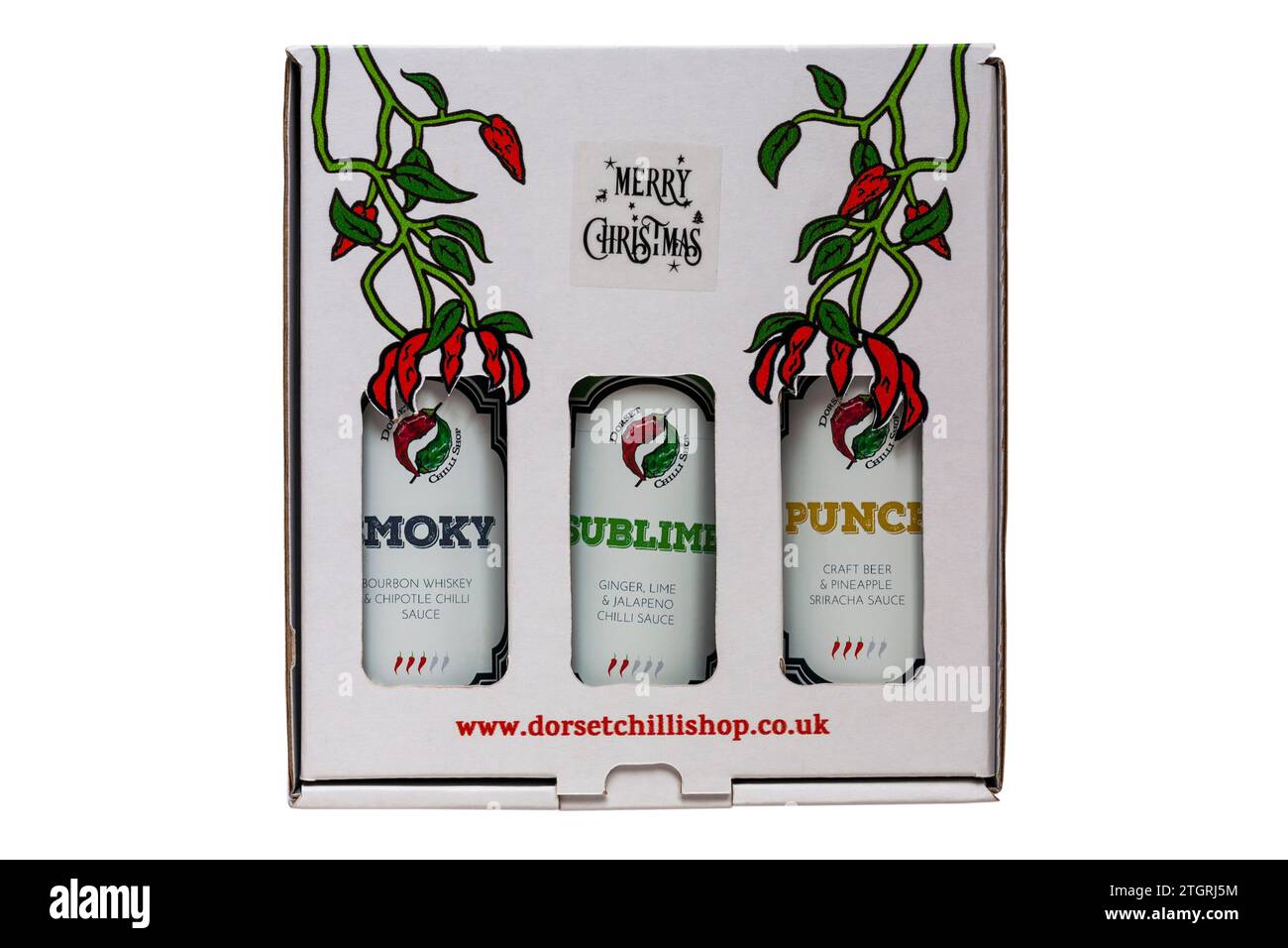 Confezione regalo natalizia Dorset Chilli Shop con tre diverse bottiglie di salsa al peperoncino Smoky, Sublime, Punch isolato su sfondo bianco Foto Stock