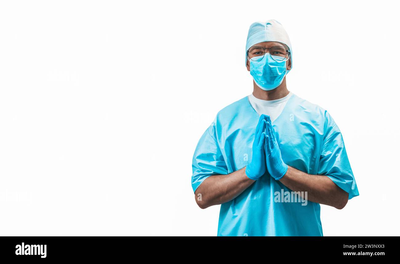 Ritratto di un medico preghiere. Concetto di medicina. Supporti misti Foto Stock