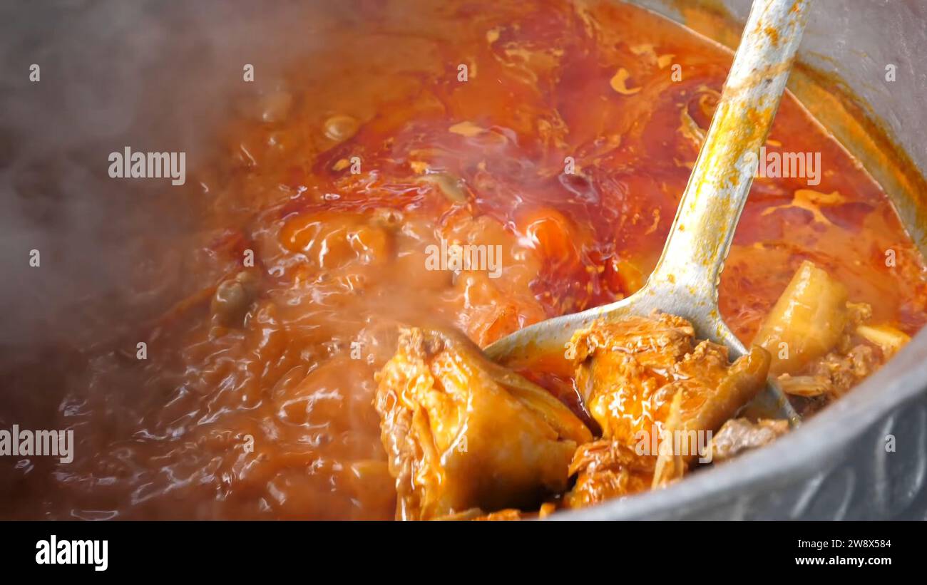 Cooking Mutton Curry, Ghana Foto Stock