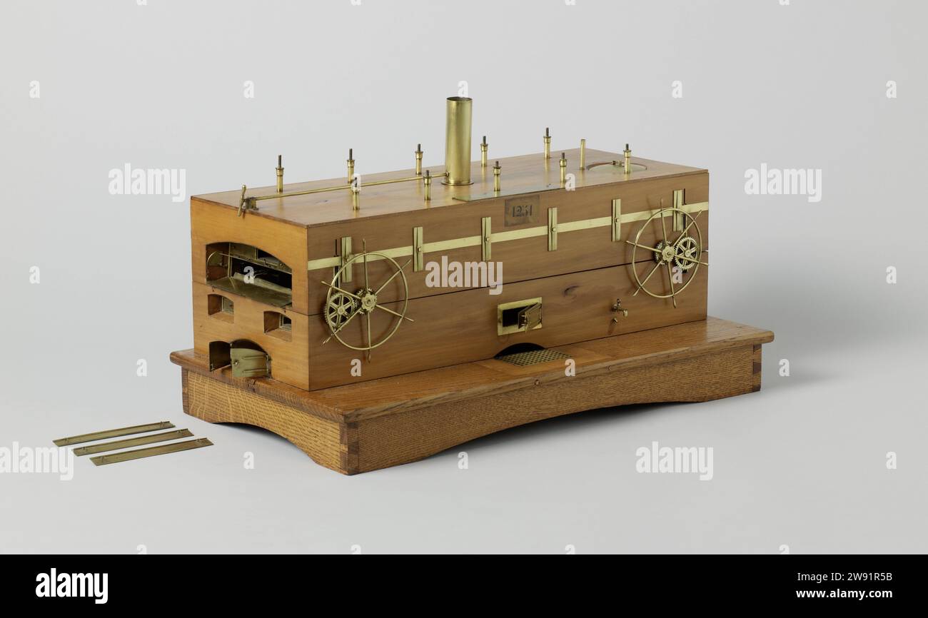 Modello di forno per pane, anonimo, modello dimostrativo 1860 - 1870 modello di forno da forno meccanico su una tavola di terra. Si tratta di una struttura a forma di scatola che può essere impostata in due metà per mostrare l'interno. Al centro del lungo fronte c'è un caminetto con Ashpuil sotterraneo. All'interno, i gas caldi sono condotti attraverso canali piatti ai quattro angoli, da lì a un doppio soffitto metallico sopra il forno e infine attraverso una pietra di abbattimento; il camino ha una valvola che può essere azionata dall'esterno. I canali sono dotati di valvole negli angoli che possono essere azionate con una chiave dall'esterno. La vera b Foto Stock