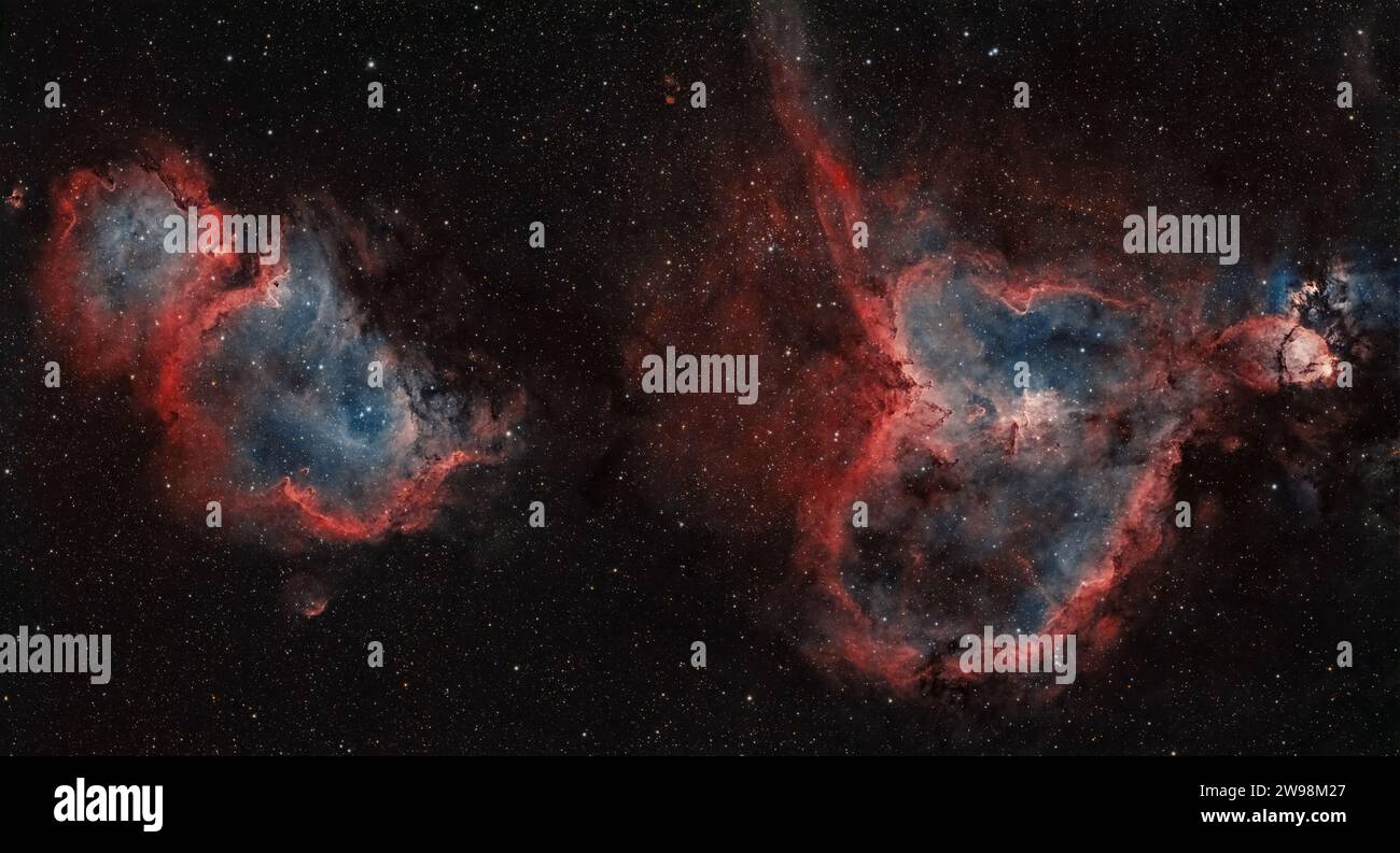 Nel balletto cosmico di Heart and Soul Nebulae, le stelle girano in una danza eterna, dipingendo l'universo con le sfumature dell'amore e dell'incanto celeste Foto Stock