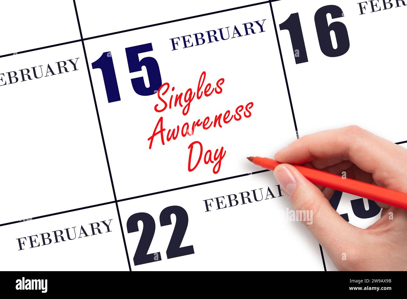 15 febbraio. Scrivere a mano il testo Singles Awareness Day nella data del calendario. Segnatevi la data. Vacanze. Concetto di giorno dell'anno. Foto Stock