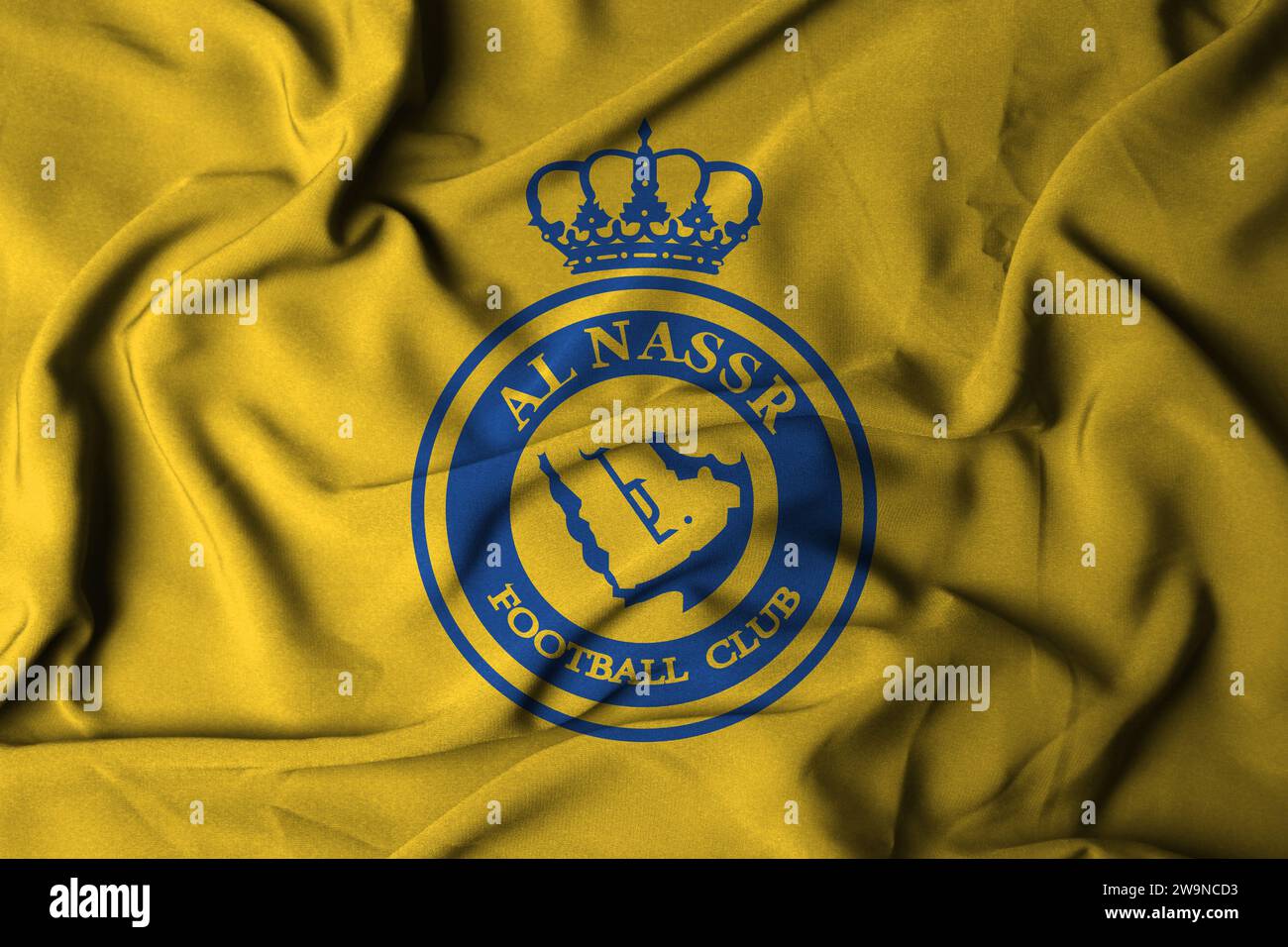 Focus selettivo al nassr fc logo della squadra di calcio. Una squadra di calcio dell'Arabia Saudita con sede a Riyadh. con una texture fluida. Illustrazione 3D. Foto Stock