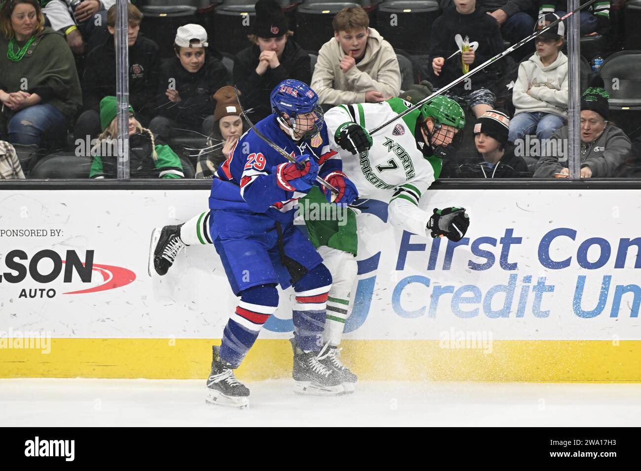 La squadra statunitense U-18 Shane Vansaghi (29) controlla il North Dakota Fighting Hawks Garrett Pyke (7) durante una partita di hockey universitario NCAA tra la nazionale statunitense U-18 e la University of North Dakota Fighting Hawks alla Ralph Engelstad Arena di Grand Forks sabato 30 dicembre 2023. Gli USA U18 hanno vinto 4-3 ai supplementari. Foto di Russell Hons/CSM Foto Stock