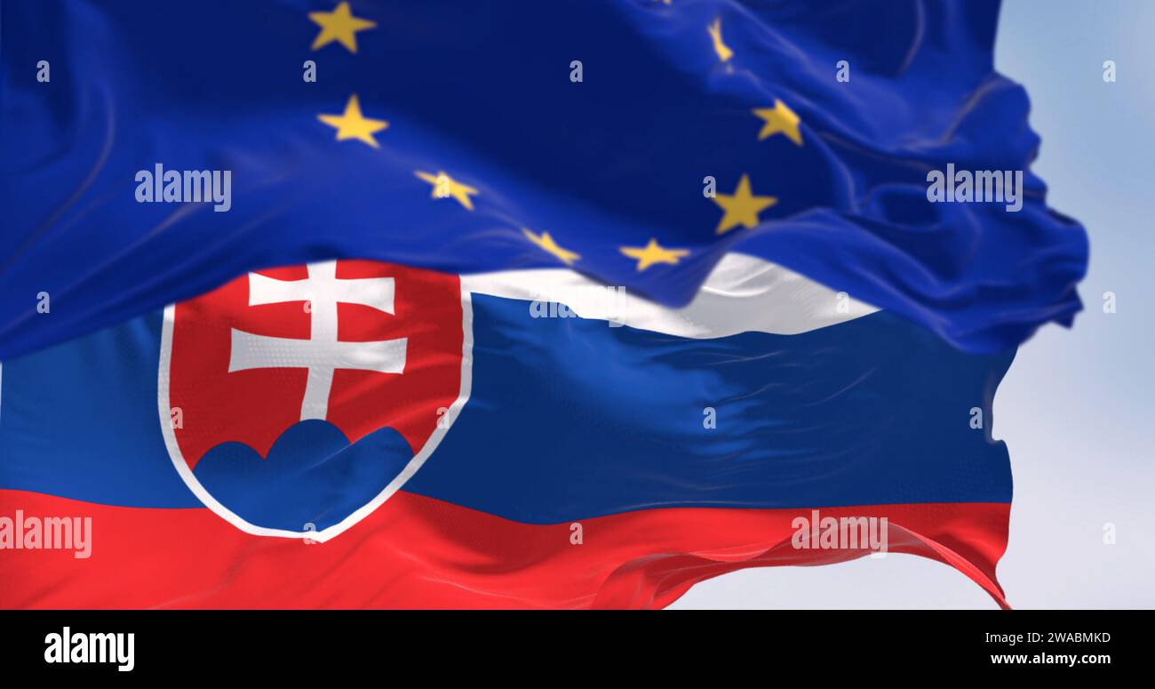 Primo piano della Slovacchia e delle bandiere dell'Unione europea che sventolano al vento in una giornata limpida. La Slovacchia è membro dell'Unione europea e della zona euro. 3d i Foto Stock