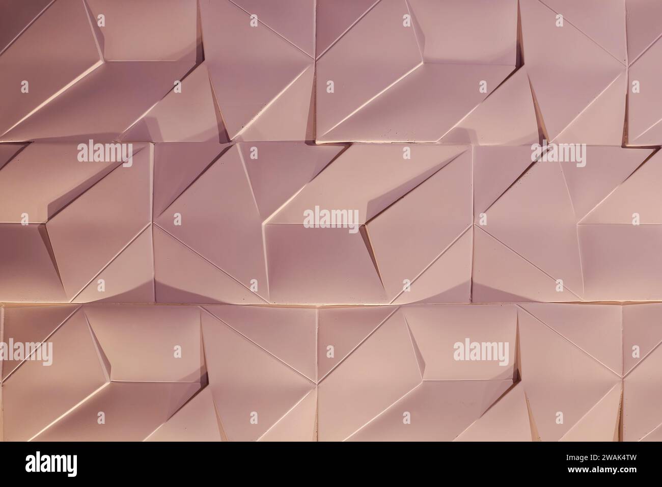 texture murale con mattoni di cemento, sfondo astratto con tonalità calde ed effetti di luce e ombra Foto Stock