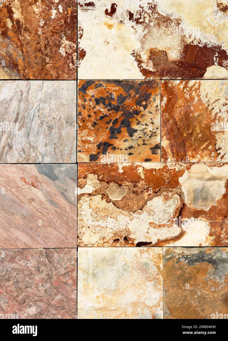 Muro in pietra di natura antica da piccole parti quadrate di marmo e granito. Sfondo o texture per interni o design. Foto Stock