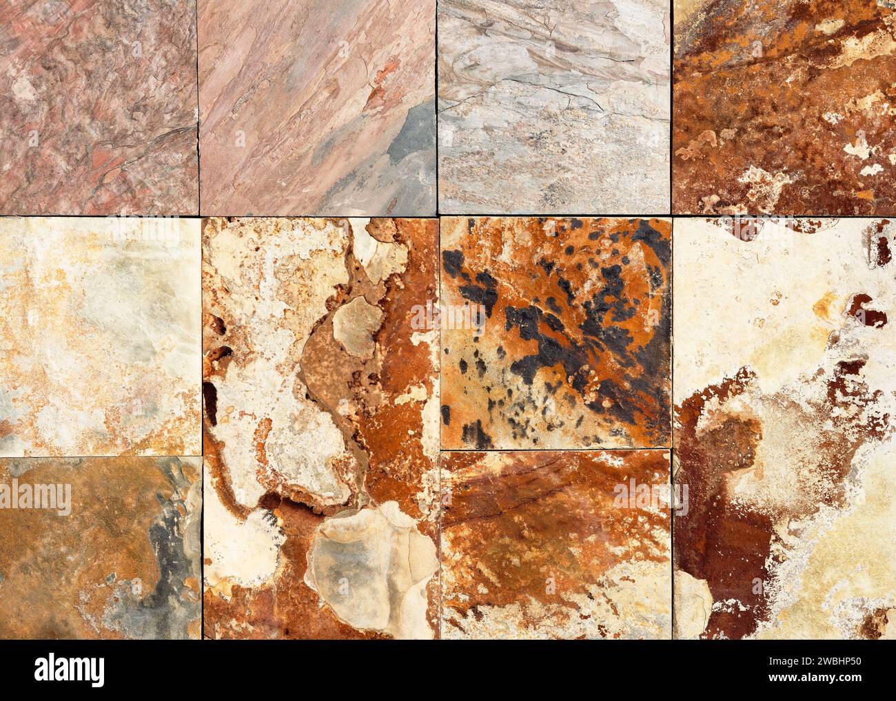 Sfondo o texture orizzontale per interni o design. Vecchio muro di pietra naturale con piccole parti quadrate di marmo e granito. Foto Stock