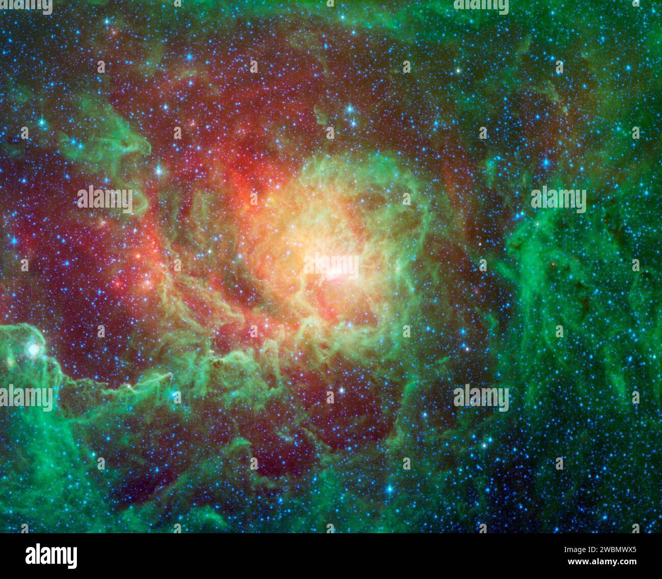 Nuvole di polvere vorticose e luminose stelle appena nate dominano la vista in questa immagine della nebulosa della laguna del telescopio spaziale Spitzer della NASA. La nebulosa si trova nella direzione generale del centro della nostra galassia nella costellazione del Sagittario. Foto Stock