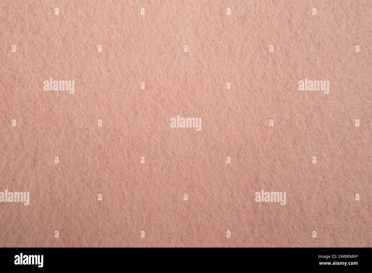 Tessuto in feltro con fibra visibile, colore rosa pesca sfondo astratto Foto Stock