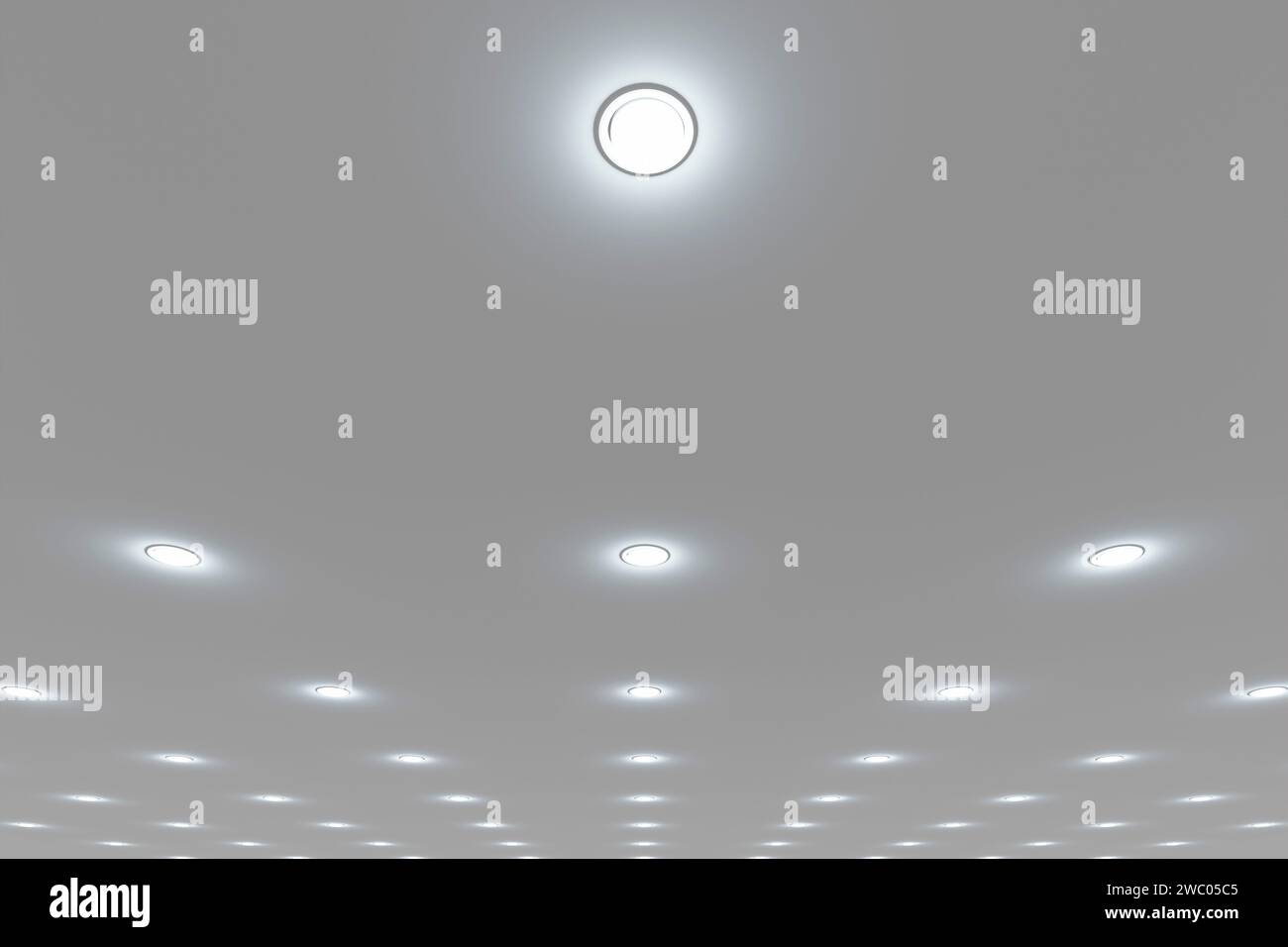 Plafoniera incassata in un soffitto bianco stretch. Foto Stock