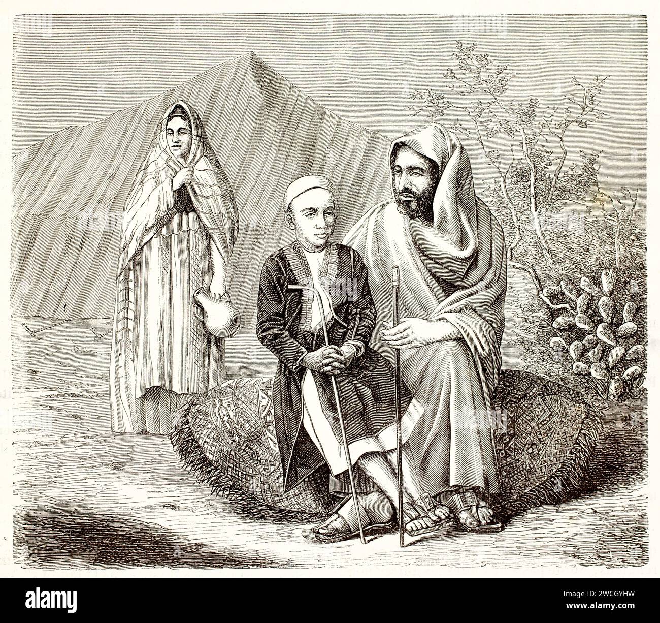 La famiglia araba di Zanzibar è seduta di fronte alla tenda del deserto e indossa abiti tradizionali. Stile espressivo tagliato in legno. Pubblicato nel 1878 da Brehm, Parigi. Foto Stock