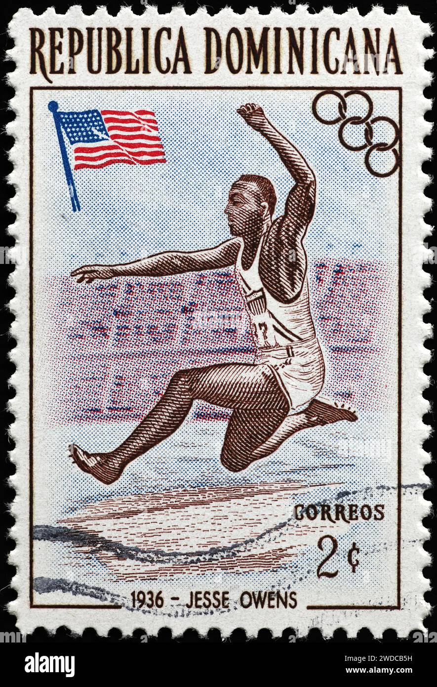 Jesse Owens in azione su francobollo vintage Foto Stock
