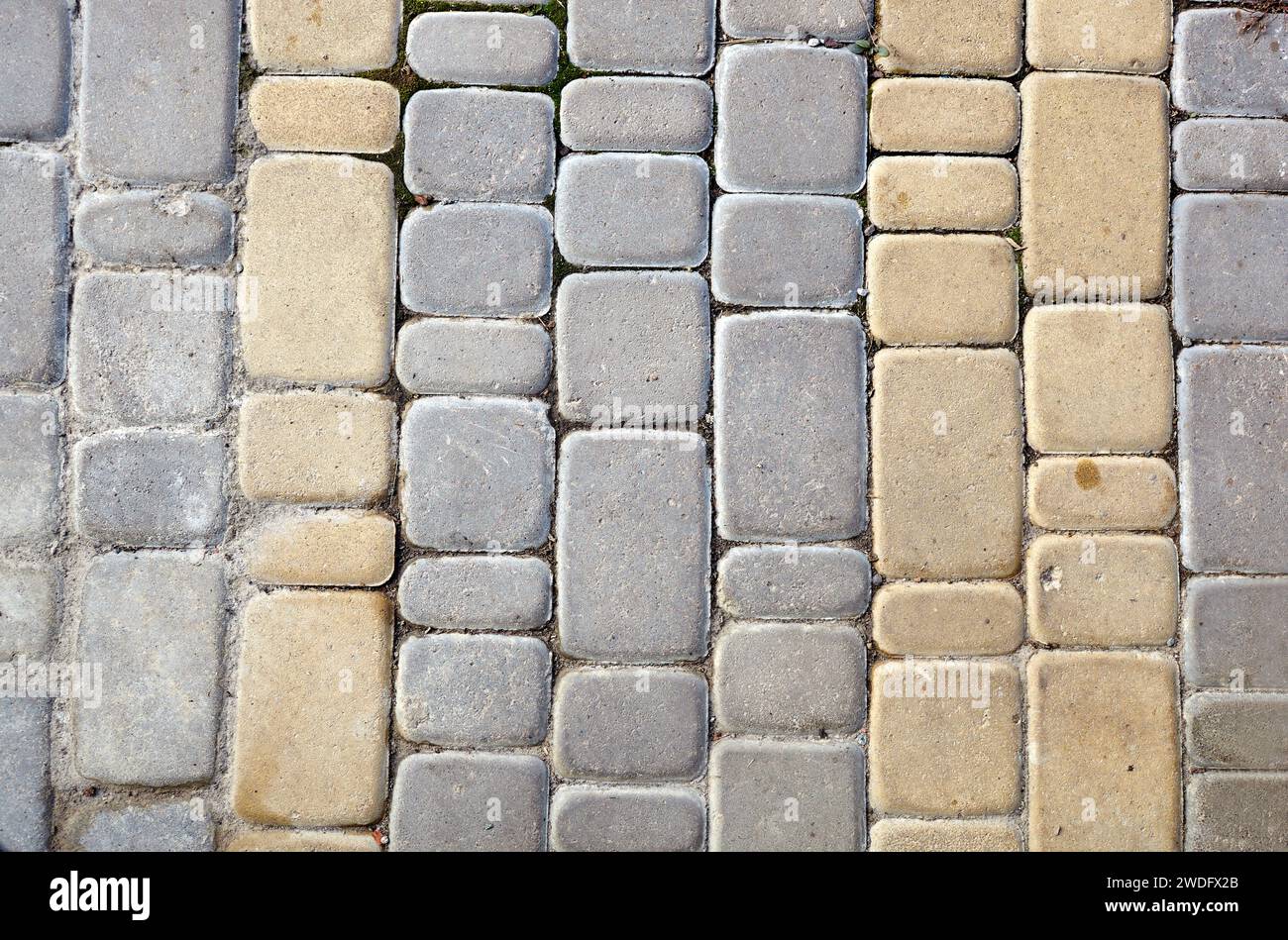 Struttura stradale in pietra. Ciottoli. Pavimento in pietra antica, vista dall'alto Foto Stock
