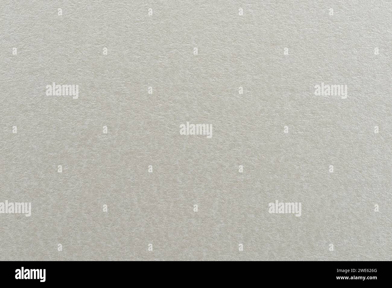 Vista ravvicinata della macro grana della carta a colori beige semplice Foto Stock