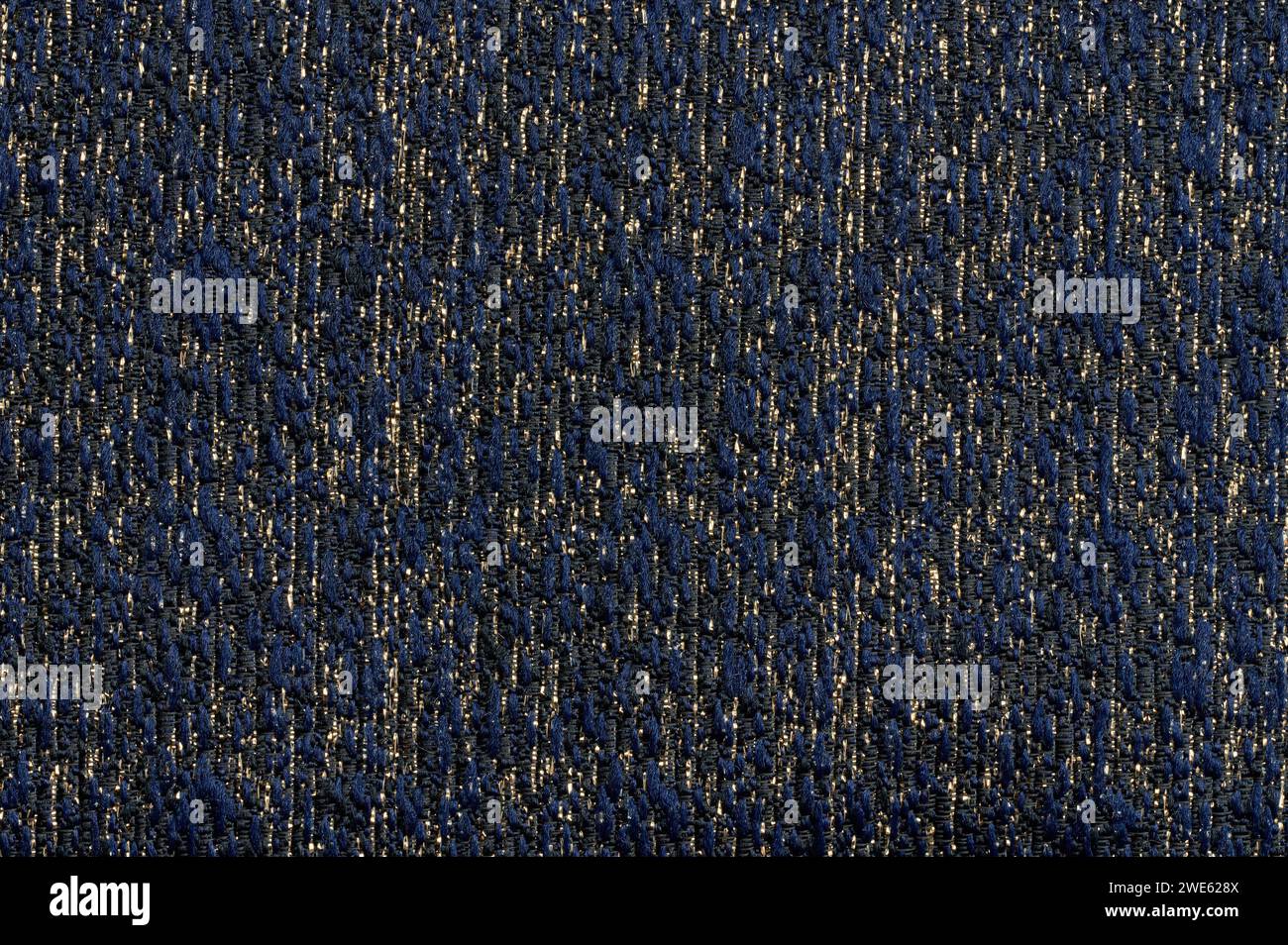 Vista ravvicinata macro texture tessili di colore blu e oro Foto Stock
