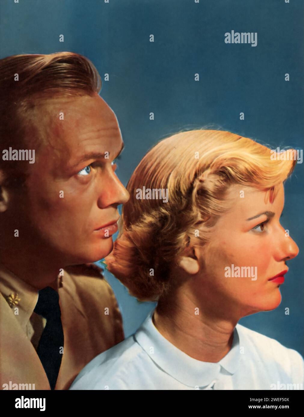 Richard Widmark e Barbara bel Geddes sono i protagonisti di "Panic in the Streets" (1950), un film noir diretto da Elia Kazan. In questo avvincente thriller, Widmark interpreta il Dottore della Marina degli Stati Uniti, tenente comandante. Clinton Reed, che ha il compito di rintracciare i portatori di una peste mortale a New Orleans. Bel Geddes interpreta la sua moglie di supporto, Nancy. Foto Stock