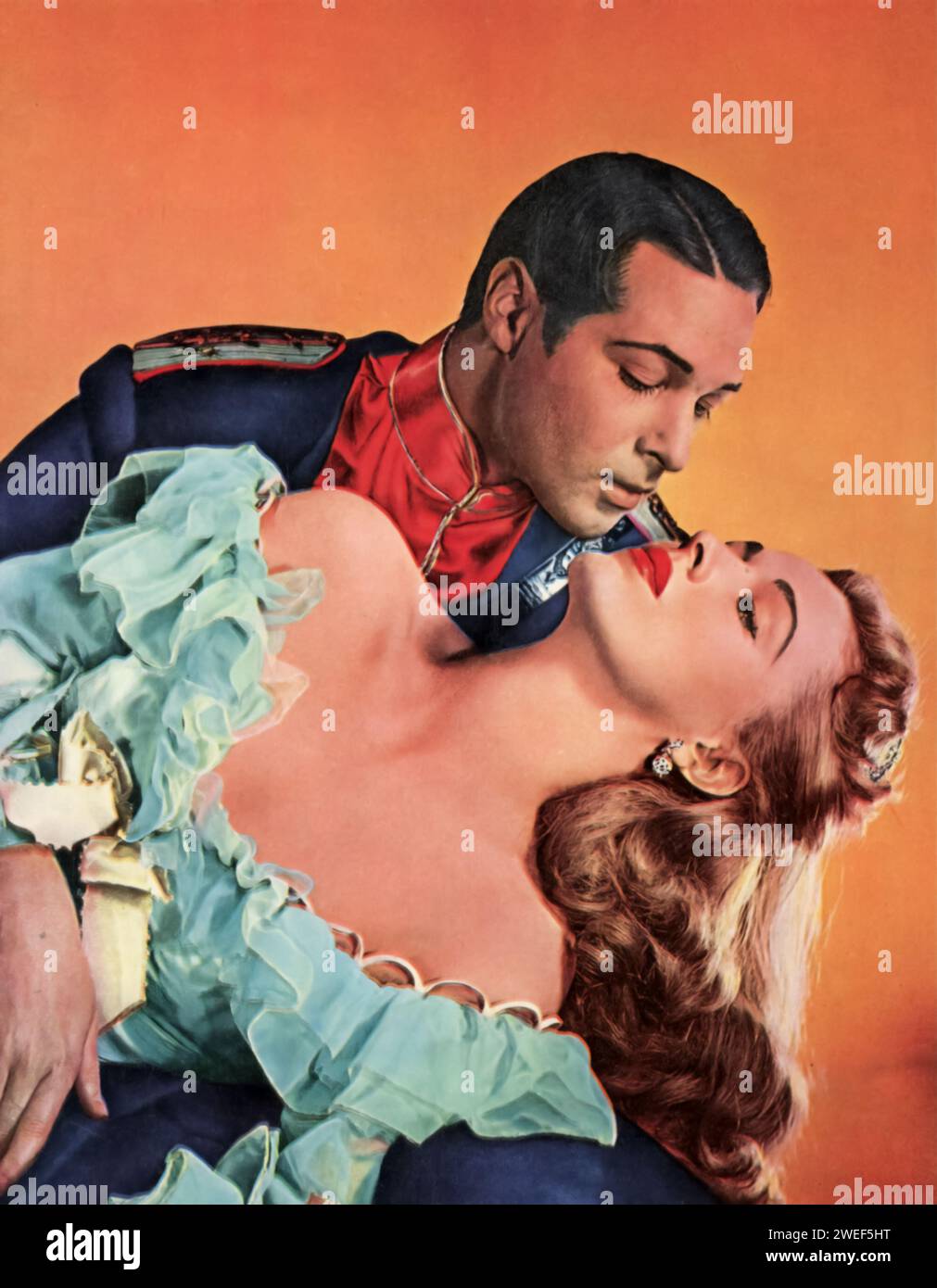 Un ritratto dell'attore Anthony Dexter e dell'attrice Eleanor Parker, protagonisti del film Valentino (1951). In questo dramma biografico, Dexter interpreta Rudolph Valentino, la leggendaria icona del cinema muto, catturando il carisma e la complessità del famoso attore. Parker interpreta Joan Carlisle, un amalgama romanzata di diverse donne nella vita di Valentino, offrendo uno sguardo alle sfide personali e professionali affrontate dalla stella. Foto Stock