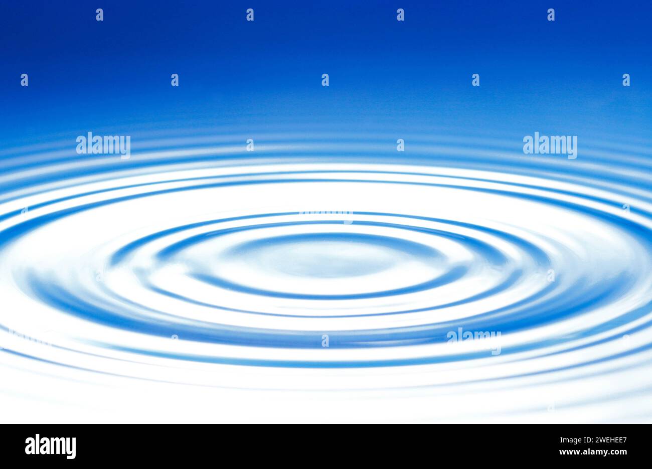 superficie blu con onde circolari Foto Stock