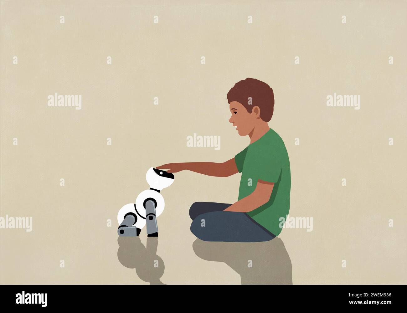 Ragazzo che gioca con un cane robotico giocattolo Foto Stock