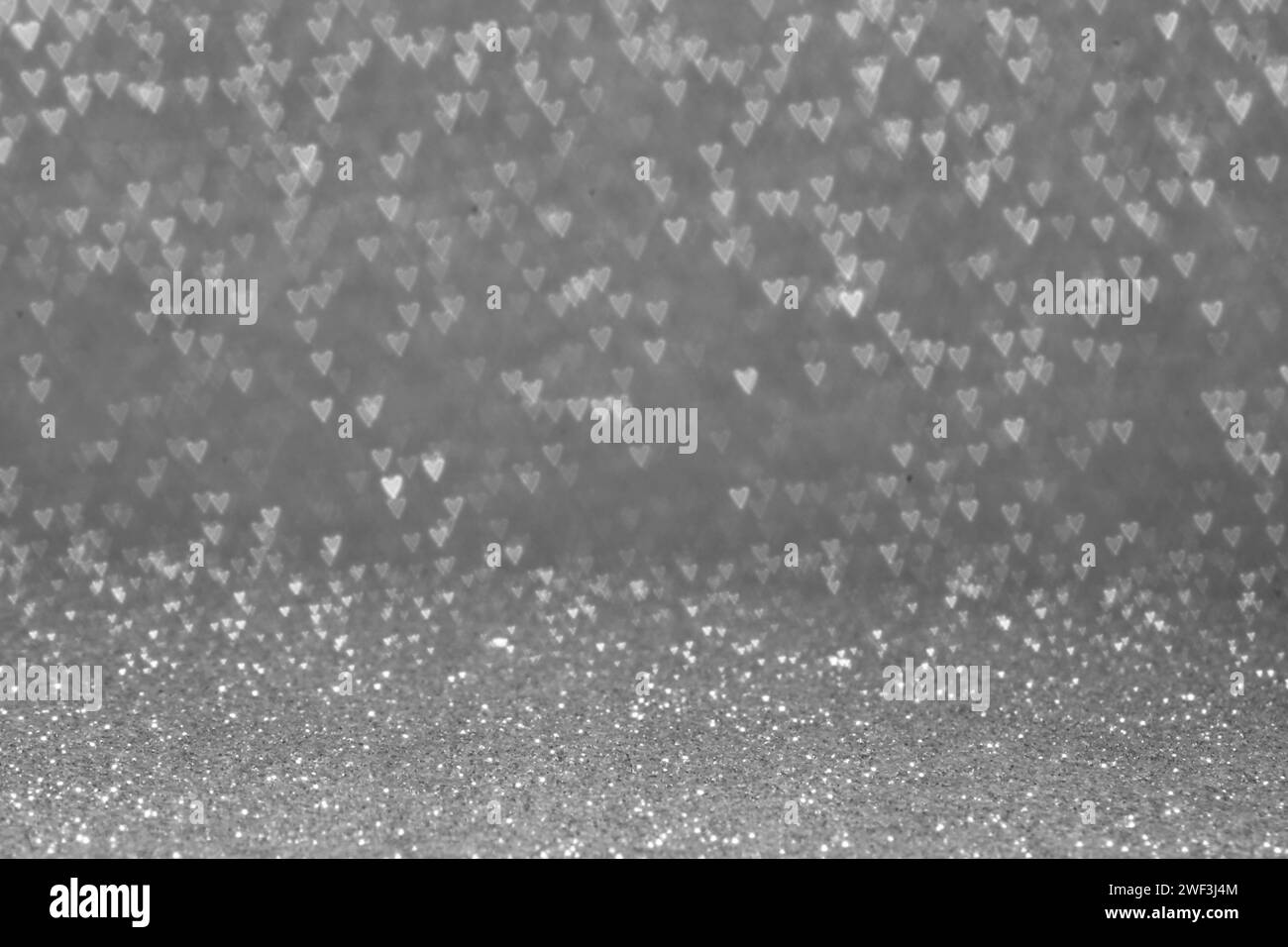 Idea di San Valentino. Sfondo grigio astratto. Cuore. Bokeh. Foto Stock