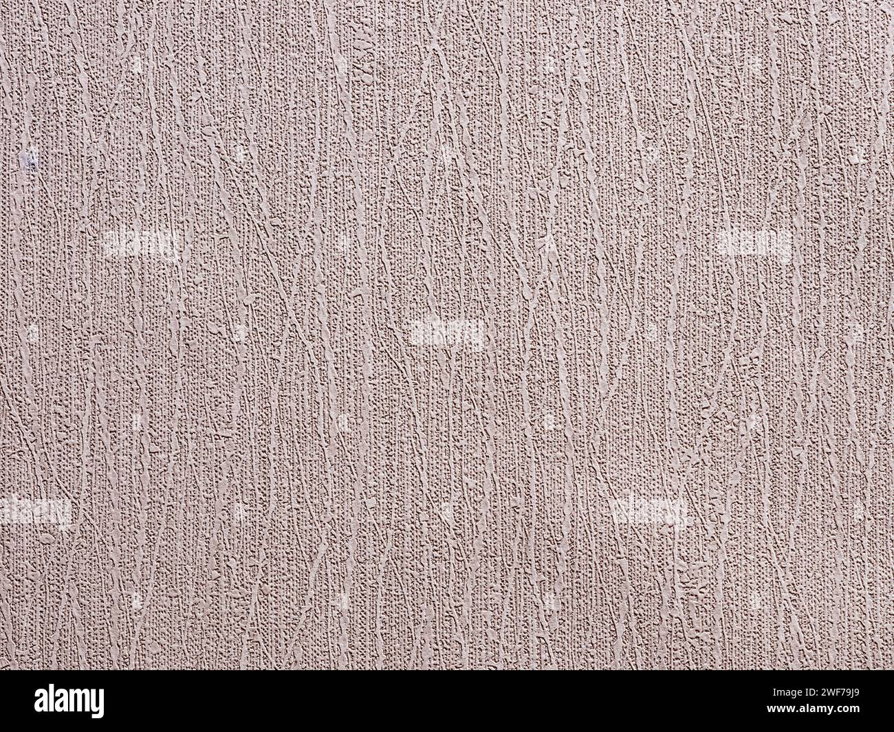 Sfondo o sfondo beige con texture astratte e motivi ondulati. Carta da parati in materiale senza cuciture, vintage ruvida, resistente agli agenti atmosferici e gru Foto Stock