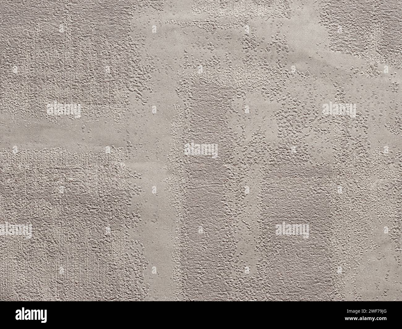 Sfondo o sfondo beige testurizzato astratto. Carta da parati in materiale senza cuciture con un look vintage ruvido, resistente agli agenti atmosferici e grunge. Carta design vintage par Foto Stock