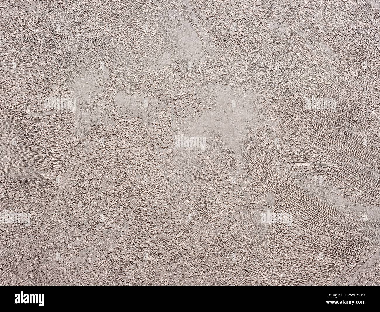 Sfondo o sfondo in stucco beige testurizzato astratto. Carta da parati in materiale senza cuciture con un look vintage ruvido, resistente agli agenti atmosferici e grunge. Carta di progettazione Foto Stock