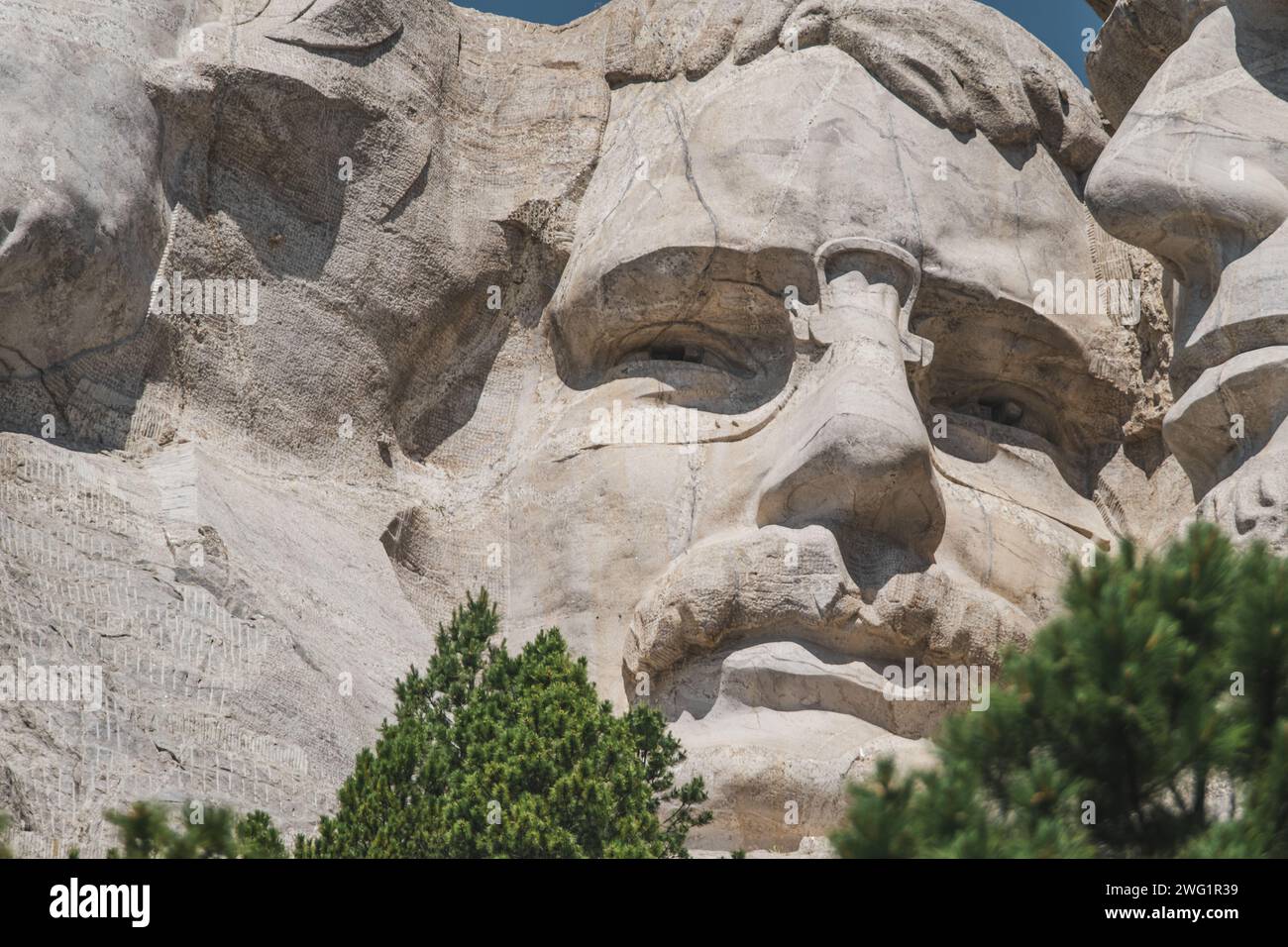 Vista ravvicinata di Theodore Roosevelt scolpito sul versante della montagna sul monte Rushmore Foto Stock