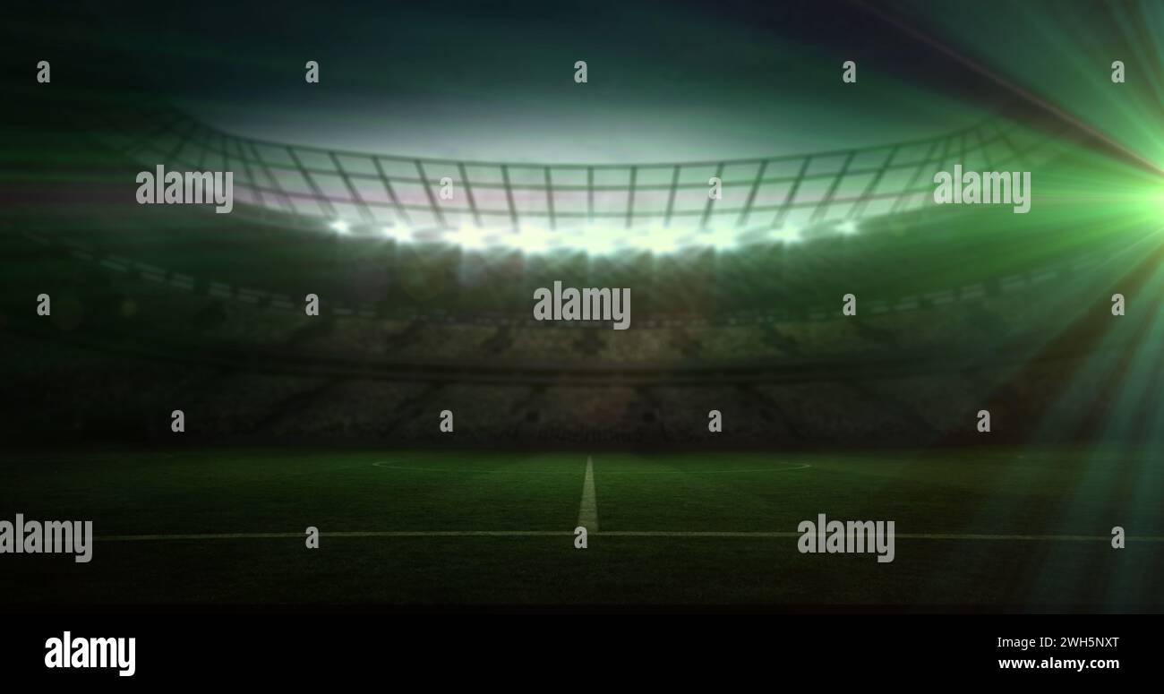 Uno stadio è illuminato da luci accese, con spazio per le copie Foto Stock