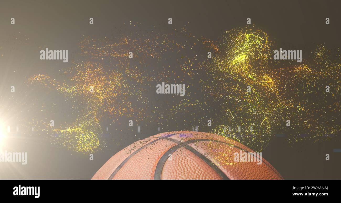 Immagine di particelle d'oro incandescenti che si muovono sul basket Foto Stock