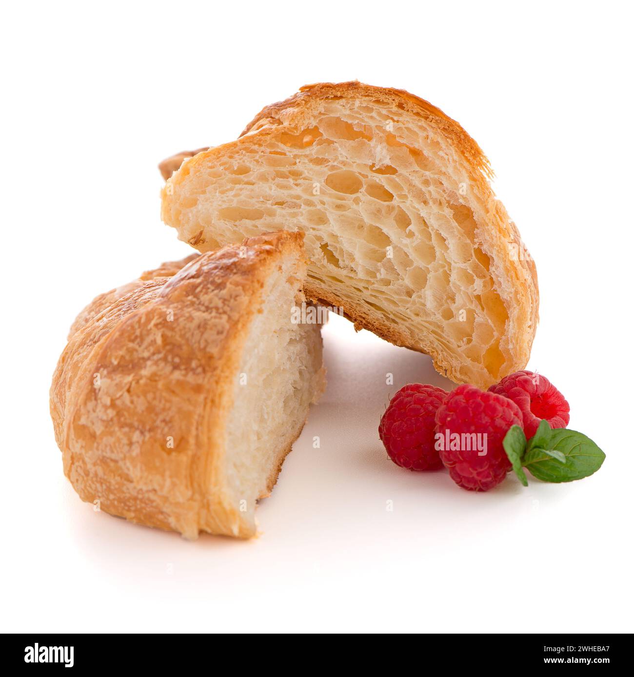 Il croissant e lamponi Foto Stock