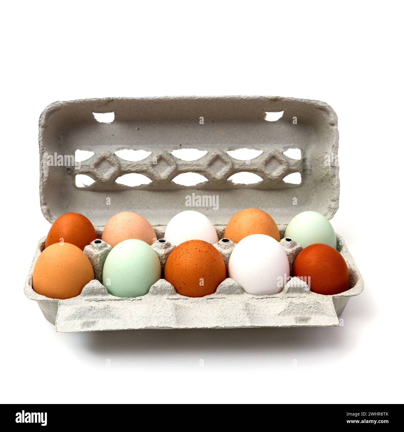 Dieci uova di pollo colorate in scatola di cartone Foto Stock