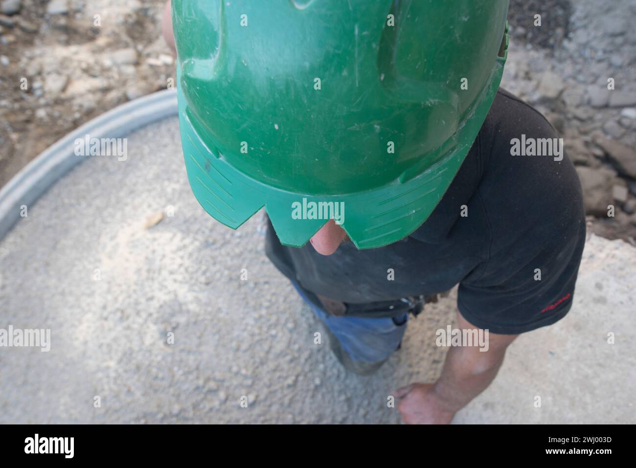 Operaio edile in cantiere Foto Stock