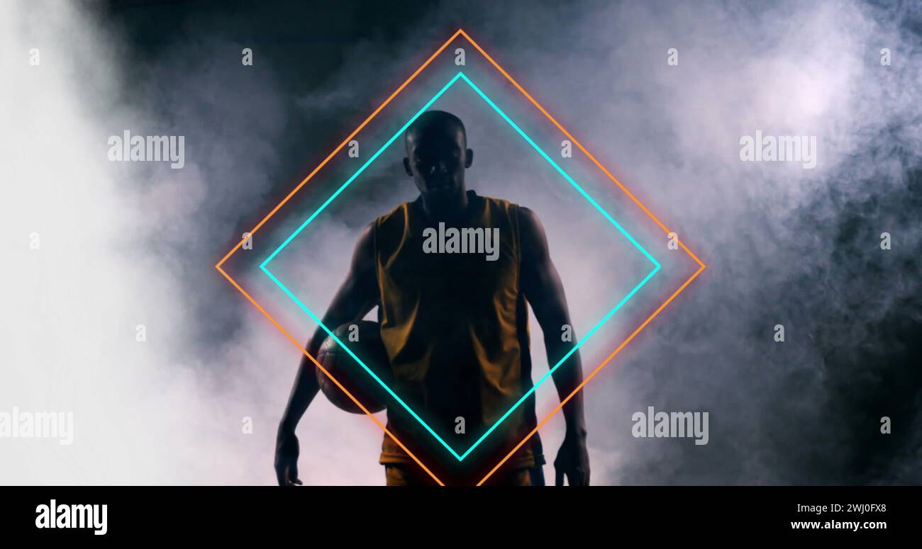 Immagine di diamanti al neon arancioni e blu sopra un giocatore di basket afroamericano che tiene la palla Foto Stock