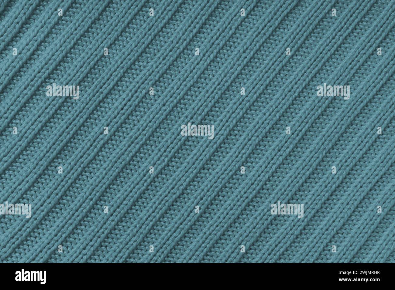 Fondo in Jersey , tessuto a righe diagonali verde-grigio. Maglieria in lana, maglione, texture superficie pullover, struttura tessile, stoffa Foto Stock